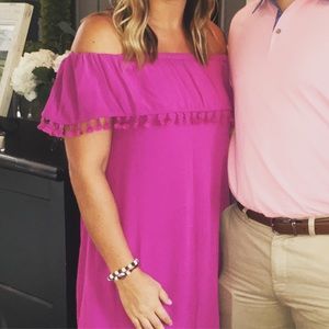 Hot pink off the shoulder dress.